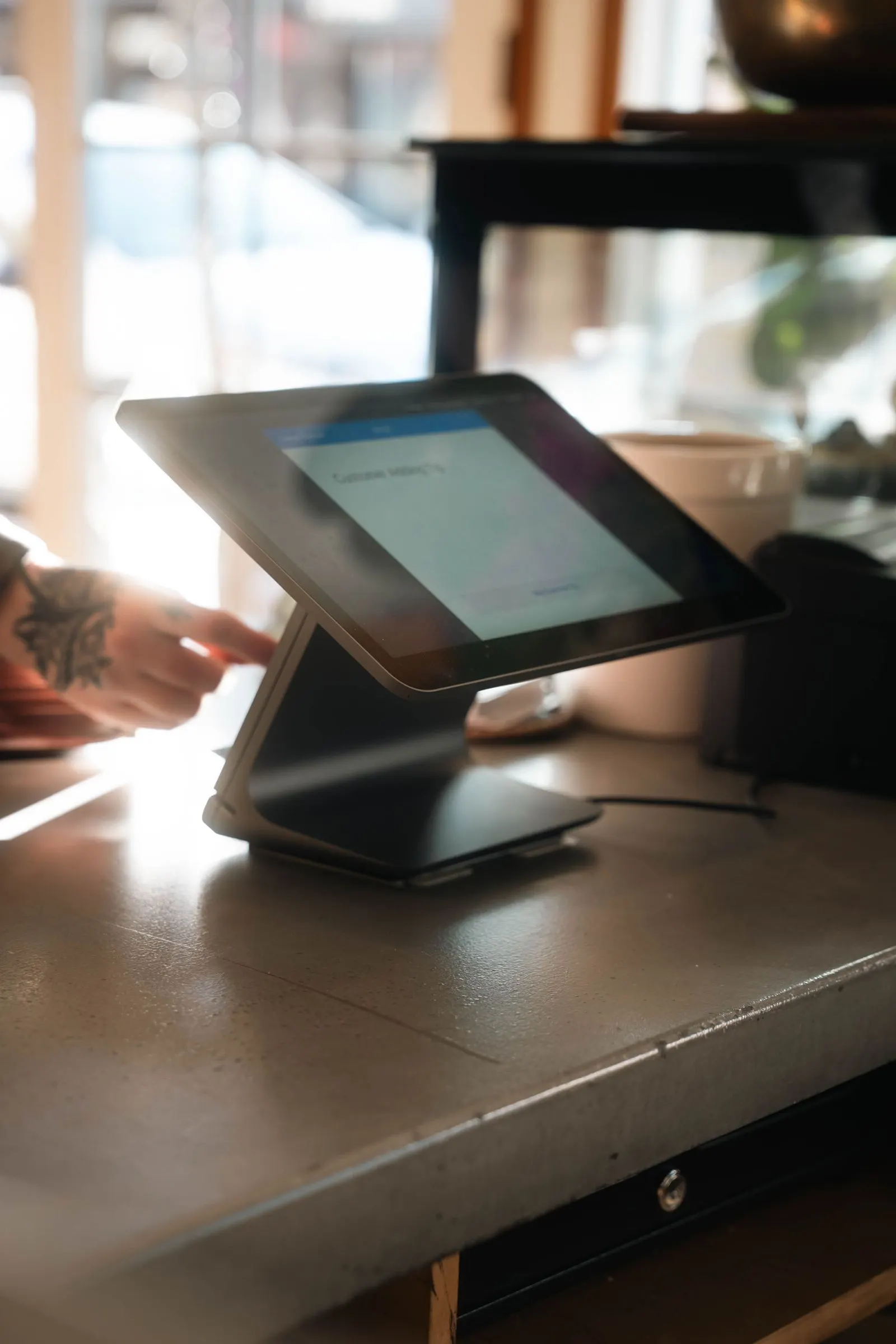 Tablet point-of-sale till on a café counter